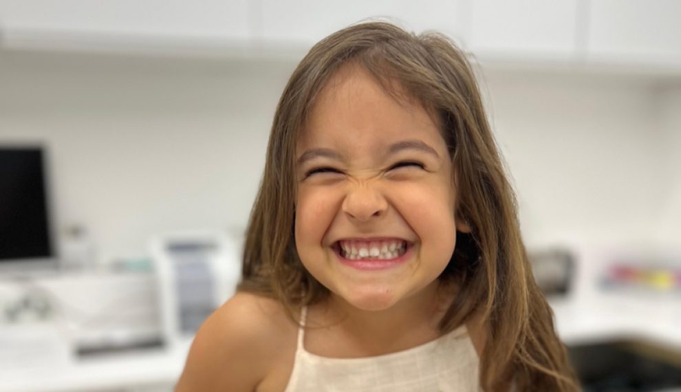 Girl in dentist practice smiling